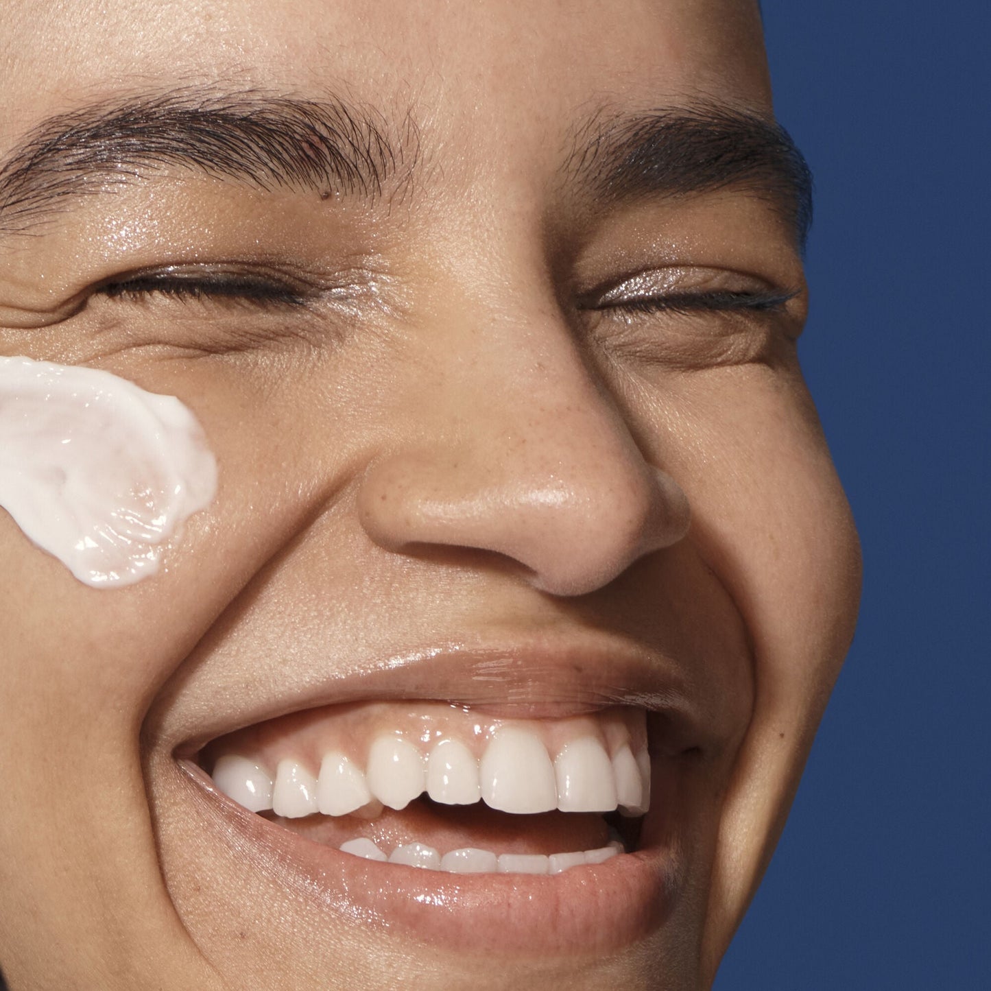 Close-up of a person who has applied  cream to their face  