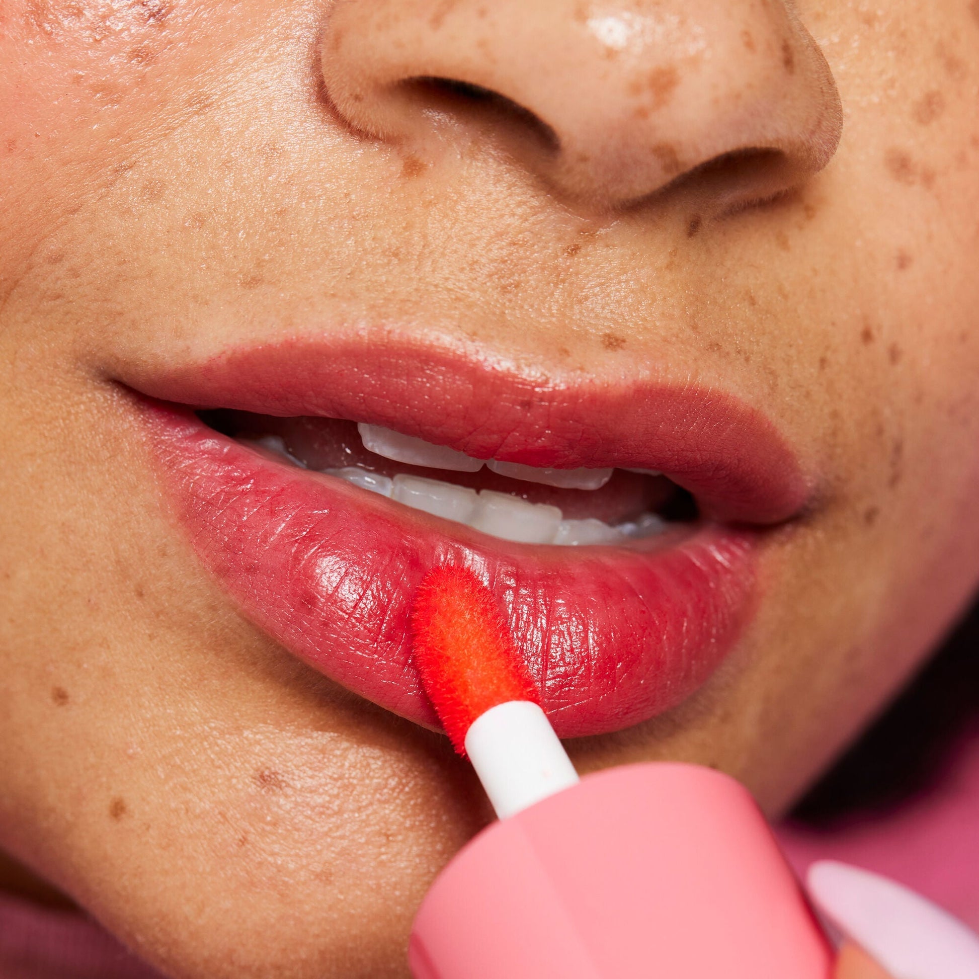 Applying Sheer For It on lips